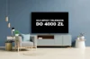 Zdjęcie telewizora stojącego na szafce w pokoju. Ekran telewizora wyświetla napis "Najlepszy telewizor do 4000 zł"